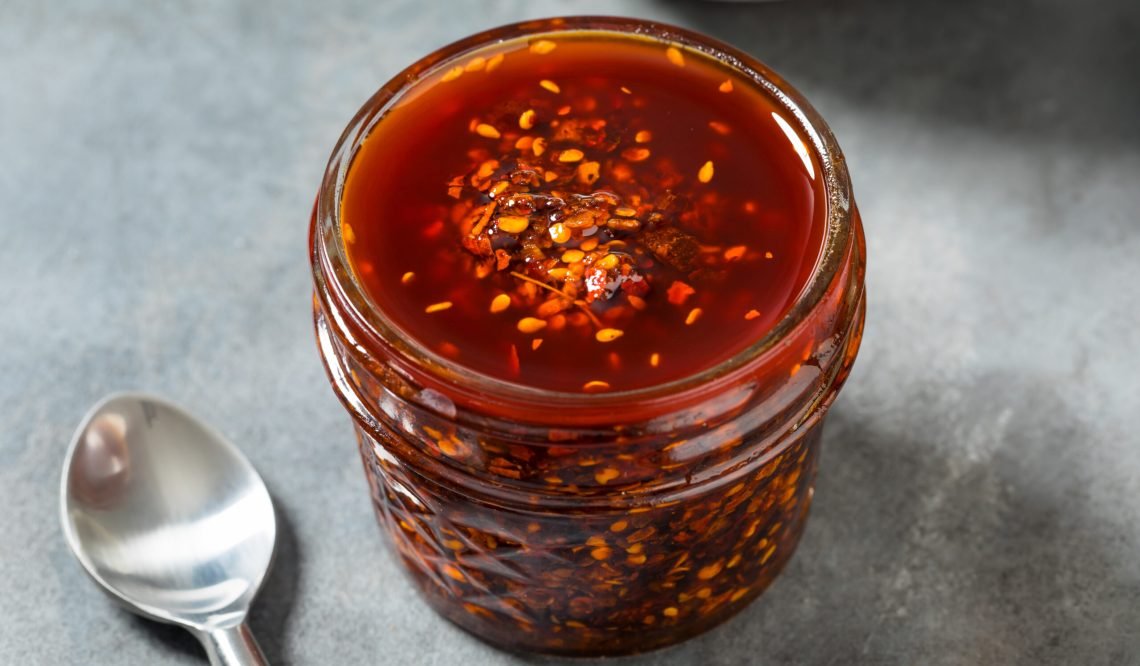 Homemade Spicy Chili Crisp Oil Sauce with Peppers and Seeds
